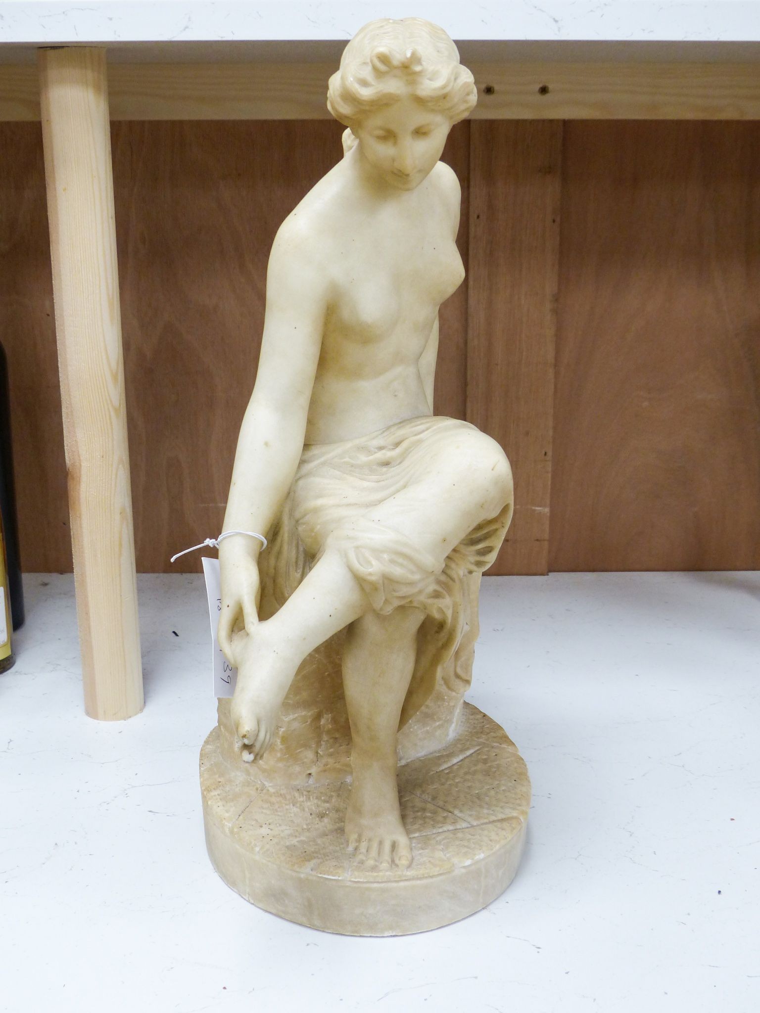 A 19th century Italian carved alabaster figure of a seated lady after the Antique, 45cm